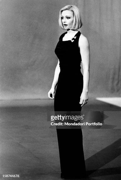 Dancer and presenter Raffaella Carrà in a dark long dress during the rehearsal of the TV show Milleluci by Antonello Falqui. Rome, 1974.