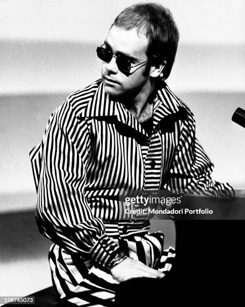 British singer, songwriter and musician Elton John playing piano. Rome, 1973