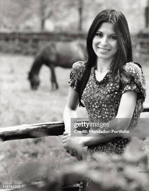 Portrait of the Italian singer and actress Rosanna Fratello in a manége. Milan, 1972