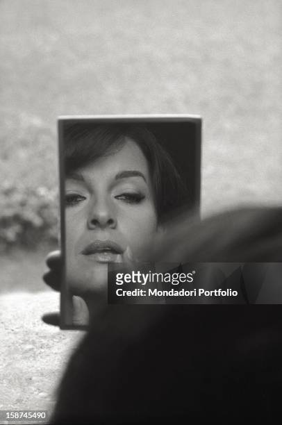 The Italian actress Lisa Gastoni looking at herself in a mirror. 1960s