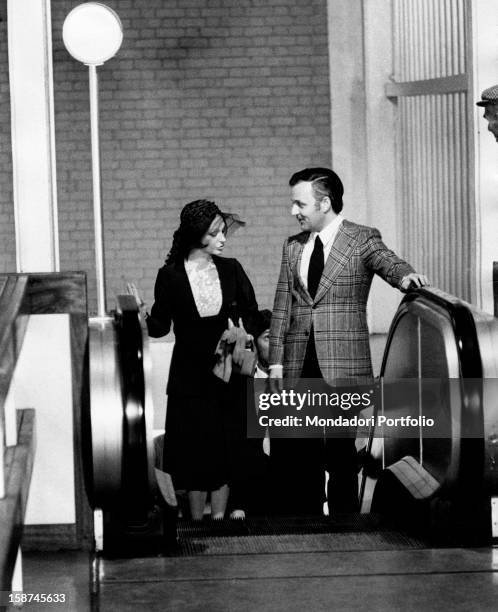 The Italian actress Adriana Asti climbing an escalator in the TV fiction Come un uragano. Clare, 1971