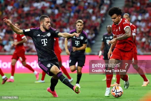 Luis Diaz of Liverpool controls the ball against Arijon Ibrahimovic of Bayern Munich during the second half of the pre-season friendly at the...