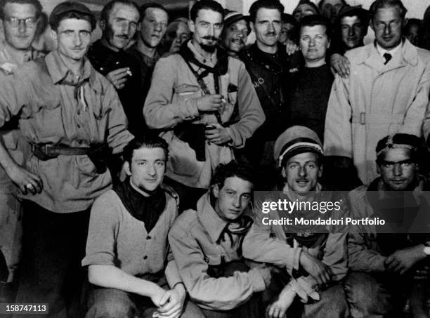 Italian partisan and lawyer Pier Luigi Bellini delle Stelle posing with some partisans after they arrested Benito Mussolini and fascist gerarchi on...