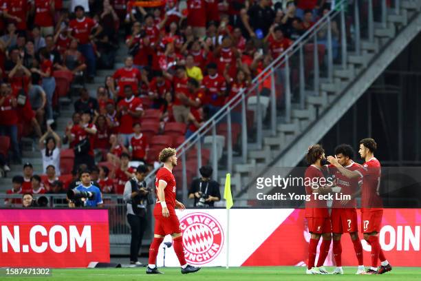 Luis Diaz of Liverpool celebrates with teammates after scoring their third goal against Bayern Munich during the second half of the pre-season...