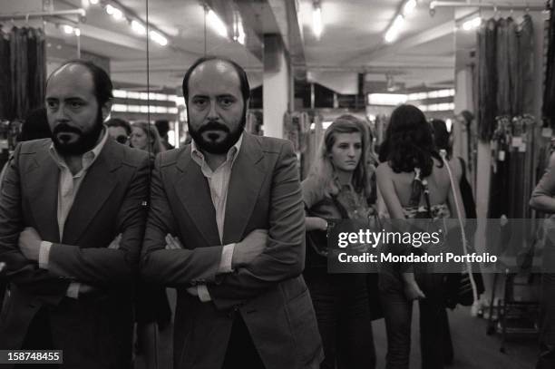 Italian fashion designer and entrepreneur Elio Fiorucci posing in a department of his shop in San Babila square. Milan, 1974