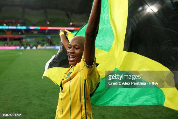 Deneisha Blackwood of Jamaica celebrates with a flag as the team advances to the round of sixteen after the FIFA Women's World Cup Australia & New...