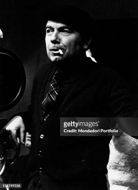 Italian director and scenarist Elio Petri filming with the camera on the set of Todo modo. 1975