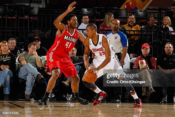 Josh Owens of the Idaho Stampede moves the ball against Fab Melo of the Maine Red Claws during the NBA D-League game on December 26, 2012 at...