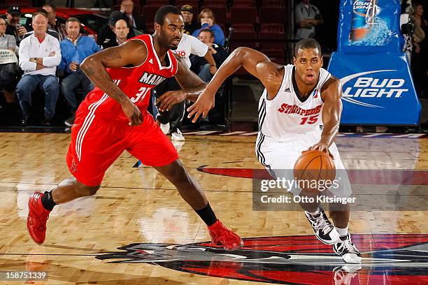 Seth Tarver drives the ball past DaJuan Summers of the Maine Red Claws during the NBA D-League game on December 26, 2012 at CenturyLink Arena in...