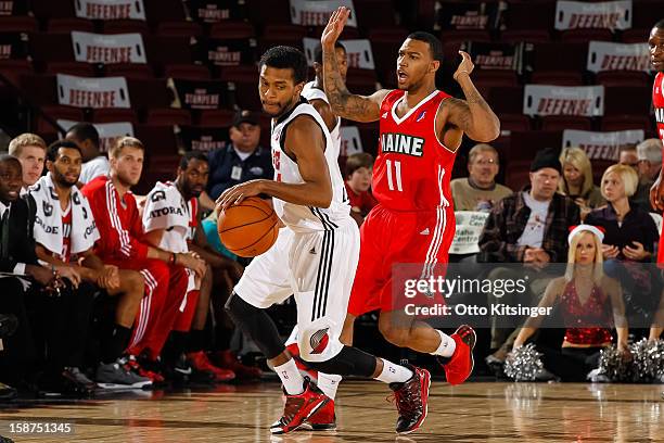 Jai Lucas of the Idaho Stampede drives the ball past Hank Thorns of the Maine Red Claws during the NBA D-League game on December 26, 2012 at...