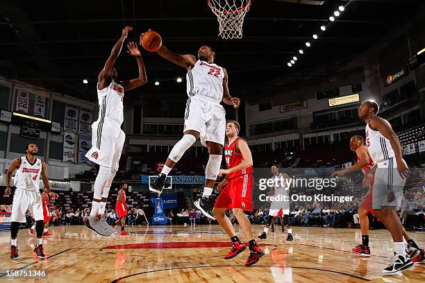 Sean Evans of the Idaho Stampede pulls down a rebound during the NBA D-League game against the Maine Red Claws on December 26, 2012 at CenturyLink...
