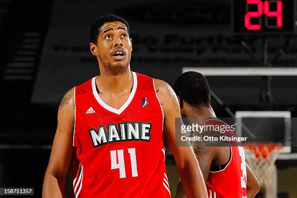 Fab Melo of the Maine Red Claws looks to the scoreboard during a break in action in the NBA D-League game against the Idaho Stampede on December 26,...