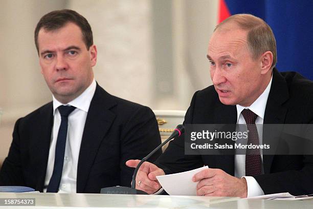 Russian President Vladimir Putin and Prime Minister Dmitry Medvedev attend a State Council meeting at Grand Kremlin Palace on December 27, 2012 in...