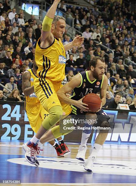 Sergio Rodriguez, #13 of Real Madrid competes with Sven Schultze, #6 of Alba Berlin during the 2012-2013 Turkish Airlines Euroleague Top 16 Date 1...