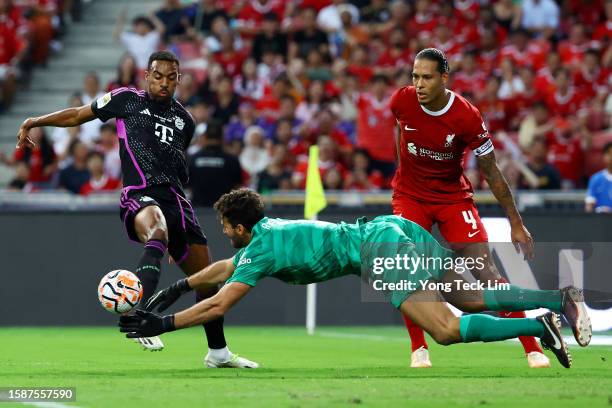 Goalkeeper Alisson Becker of Liverpool makes a save against Ryan Gravenberch of Bayern Munich during the second half of the pre-season friendly at...