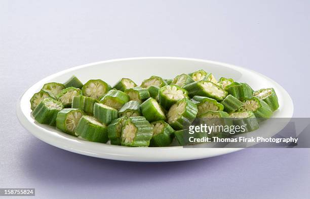 plate of sliced okra -  firak stock pictures, royalty-free photos & images