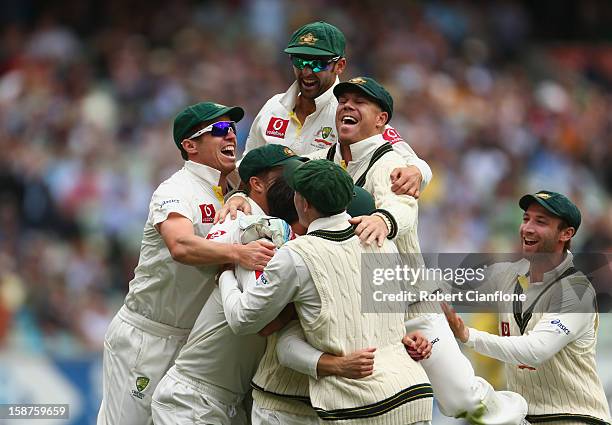 The Australian players celebrate the wicket of Tillakaratne Dilshan of Sri Lanka after he was caught by Ed Cowan off the bowling of Mitchell Johnson...