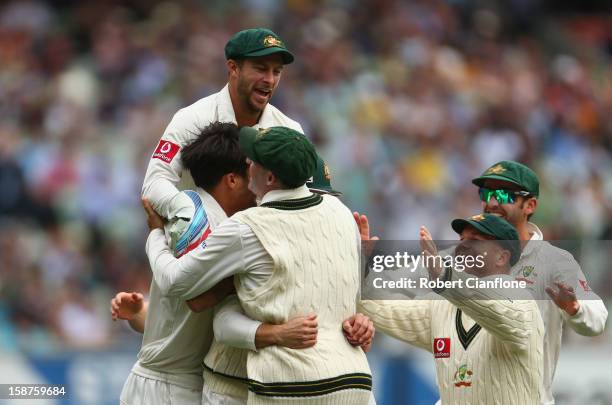 The Australian players celebrate the wicket of Tillakaratne Dilshan of Sri Lanka after he was caught by Ed Cowan off the bowling of Mitchell Johnson...