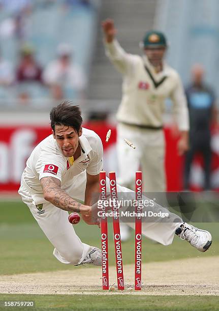Mitchell Johnson of Australia runs out Dimuth Karunaratne during day three of the Second Test match between Australia and Sri Lanka at Melbourne...