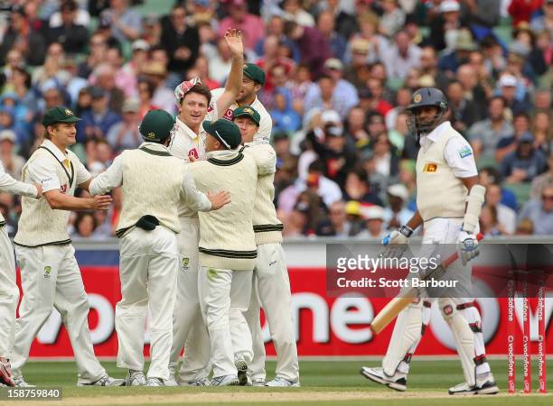 Jackson Bird of Australia celebrates with his team mates after bowling Thilan Samaraweera of Sri Lanka during day three of the Second Test match...