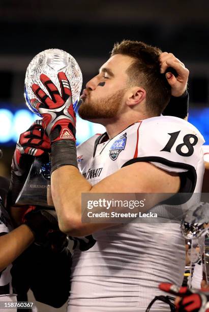 Travis Kelce of the Cincinnati Bearcats celebrates with the trophy after catching the game winning touchdown to defeat the Duke Blue Devils 48-34...