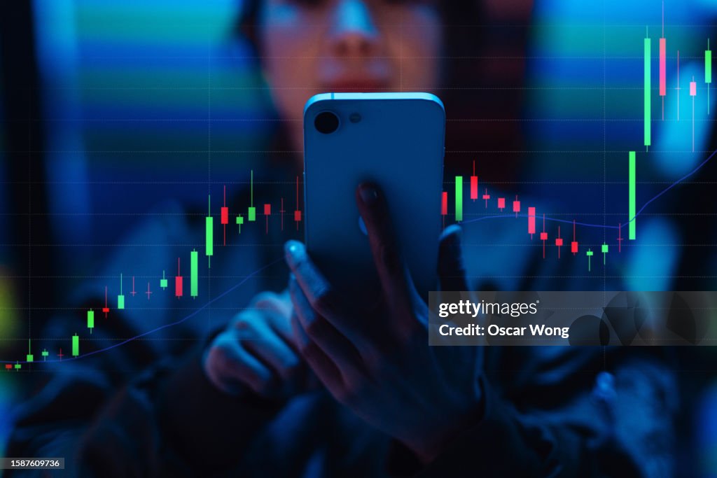 Young woman analysing data with augmented reality device