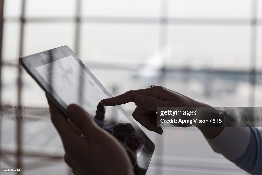 Using digital tablet in airport