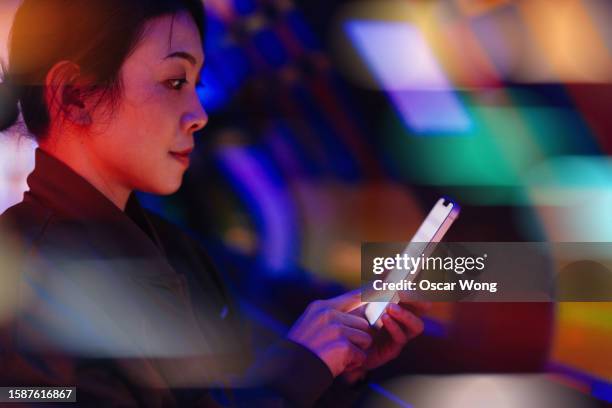 asian business woman using smartphone against futuristic background - personal data stock pictures, royalty-free photos & images