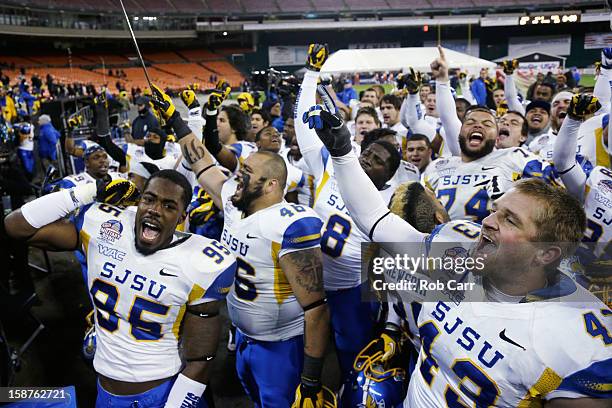 Sean Bacon and Travis Johnson of the San Jose State Spartans celebrate after defeating the Bowling Green Falcons 29-20 to win the Military Bowl at...