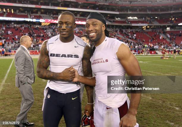 Wide receiver Brandon Marshall of the Chicago Bears and wide receiver Larry Fitzgerald of the Arizona Cardinals pose together following the NFL game...