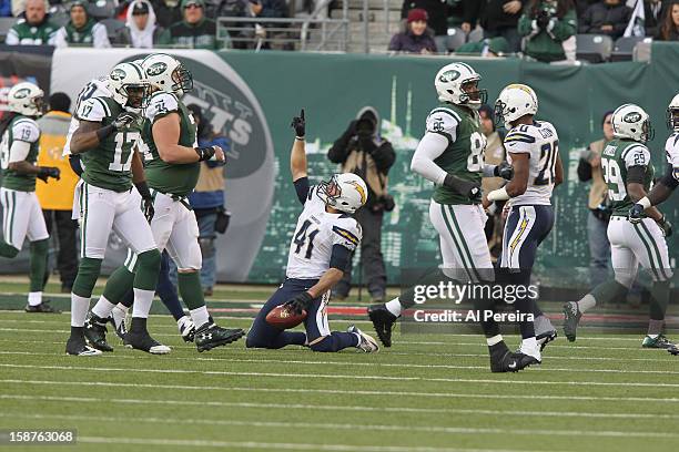 Strong Safety Corey Lynch of the San Diego Chargers has an Interception and eludes Quarterback Greg McElroy of the New York Jets when the New York...