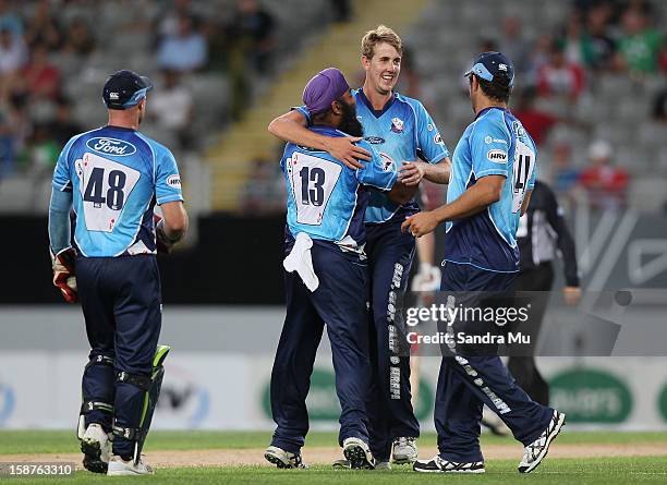 Matt Quinn of Auckland celebrates bowling out Jesse Ryder of Wellington during the HRV Cup Twenty20 match between the Auckland Aces and Wellington...