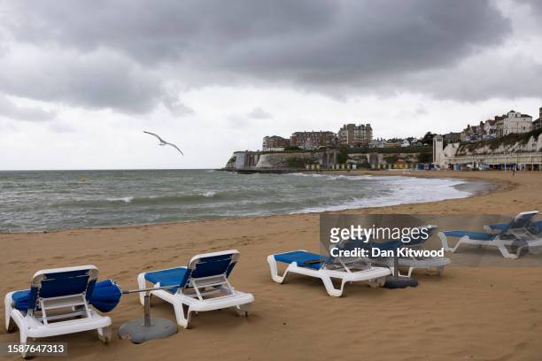 Row of sun loungers on an empty beach on August 02, 2023 in Broadstairs, United Kingdom. August 2023 in the UK has seen erratic weather, with...