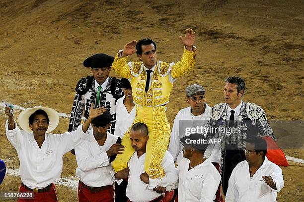 Spanish bullfighter Ivan Fandino is carried at the end of a bullfight at the Canaveralejo bullring in Cali, department of Valle del Cauca, Colombia...