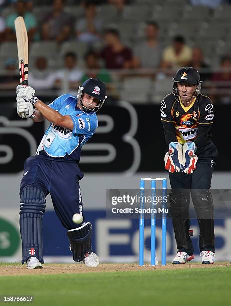 Phil Mustard of Auckland bats during the HRV Cup Twenty20 match between the Auckland Aces and Wellington Firebirds at Eden Park on December 28, 2012...