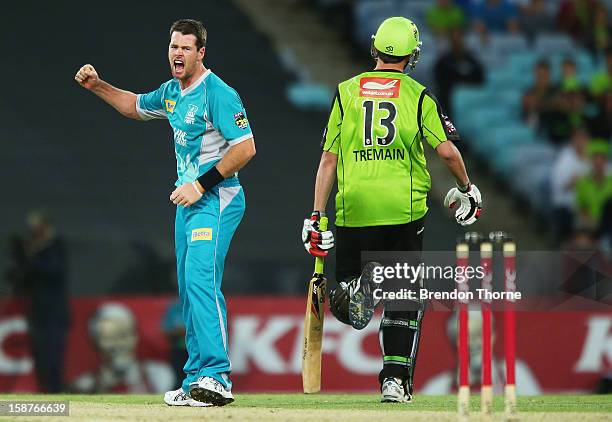 Dan Christian of the Heat celebrates after claiming the wicket of Chris Tremain of the Thunder during the Big Bash League match between the Sydney...