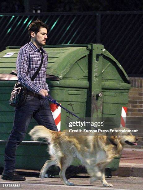 Iker Casillas is seen going for a walk with his pet dog on December 27, 2012 in Madrid, Spain.