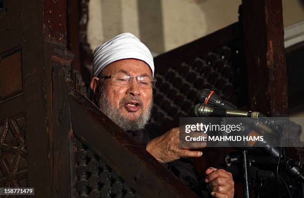 Egyptian Muslim scholar Sheikh Yusuf al-Qaradawi addresses Muslims at Al-Azhar mosque during the weekly Friday prayer in Cairo on December 28, 2012....