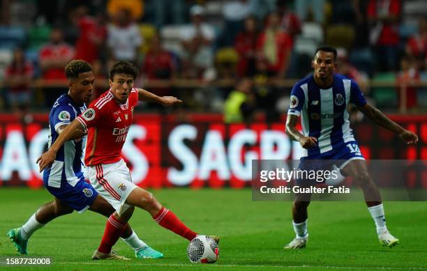 Joao Neves of SL Benfica with Danny Namaso of FC Porto in action during the SuperTaca de Portugal match between SL Benfica and FC Porto at Estadio...