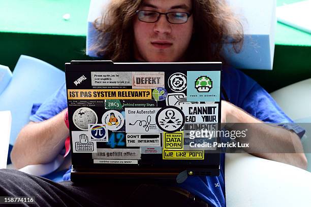 Participant works on his laptop in a foam pit at the annual Chaos Computer Club computer hackers' congress, called 29C3, on December 28, 2012 in...