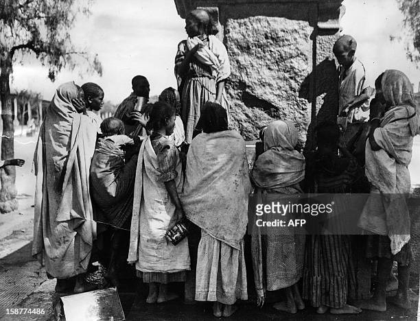 An archive photo taken on December 8, 1935 in Asmara during the Second Italo–Ethiopian War shows native women gathered around a stone fountain to...