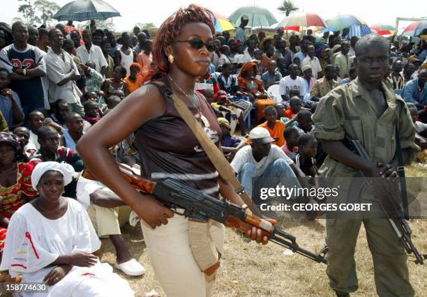 Rebels of the Ivory Coast Far West Patriotic Movement keep order in the stadium of Danane 07 February 2003 where Guillaume Soro, secretary general of...