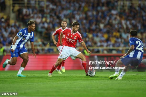 Joao Neves of SL Benfica tries to escape Danny Namaso of FC Porto and Otavio of FC Porto during the match between SL Benfica and FC Porto for the...