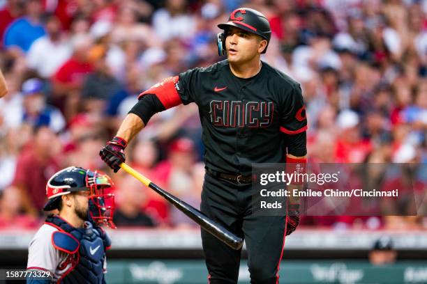 Joey Votto of the Cincinnati Reds tosses his bat after hitting a home run during a game against the Atlanta Braves at Great American Ball Park on...
