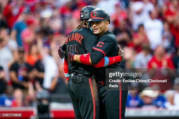 Joey Votto of the Cincinnati Reds celebrates his home run with Elly De La Cruz during a game against the Atlanta Braves at Great American Ball Park...