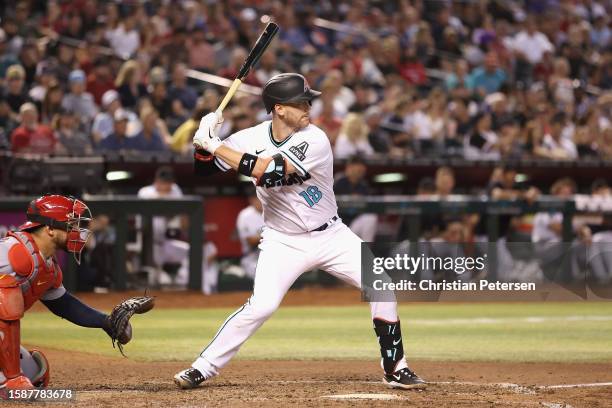 Carson Kelly of the Arizona Diamondbacks bats against the St. Louis Cardinals during the MLB game at Chase Field on July 25, 2023 in Phoenix, Arizona.