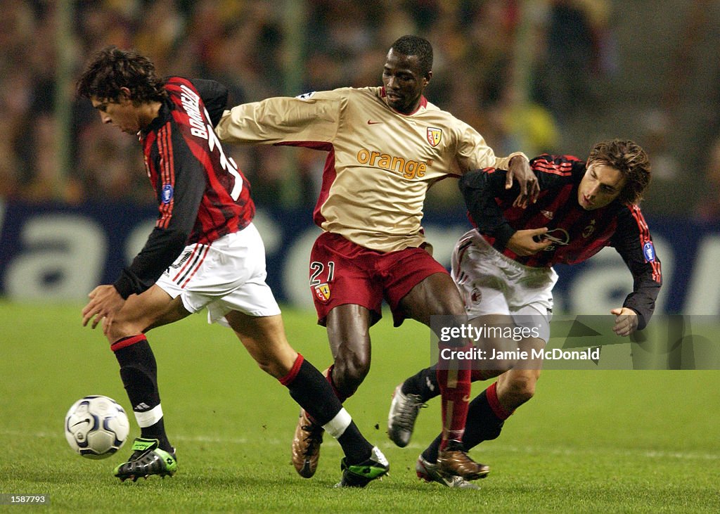 John Chukwudi Utaka of Lens, Marco Borriello and Andrea Pirlo of AC Milan