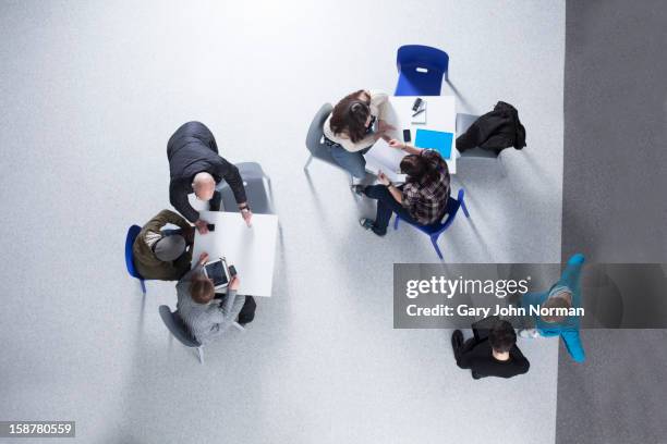 start up business planning meeting in new office - young businessman stock pictures, royalty-free photos & images