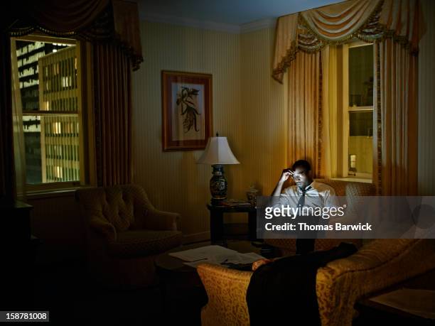 Businessman looking at digital tablet in hotel