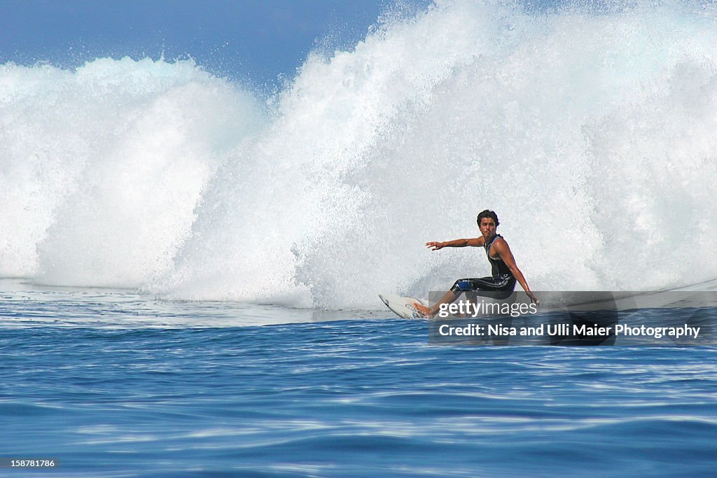 Big wave surfing at Teahupoo, Tahiti.